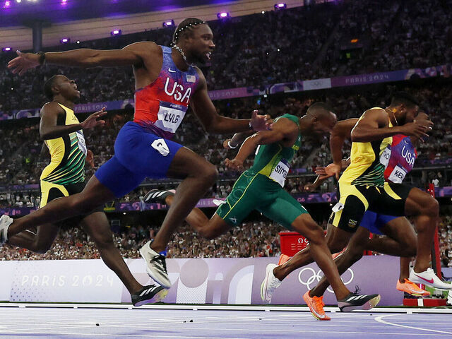 American Lyles Wins 100m Gold in Photo Finish Over Jamaica's Thompson